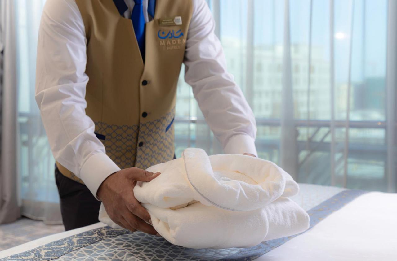 Maden Hotel Medina Exterior photo A hotel housekeeper making a bed